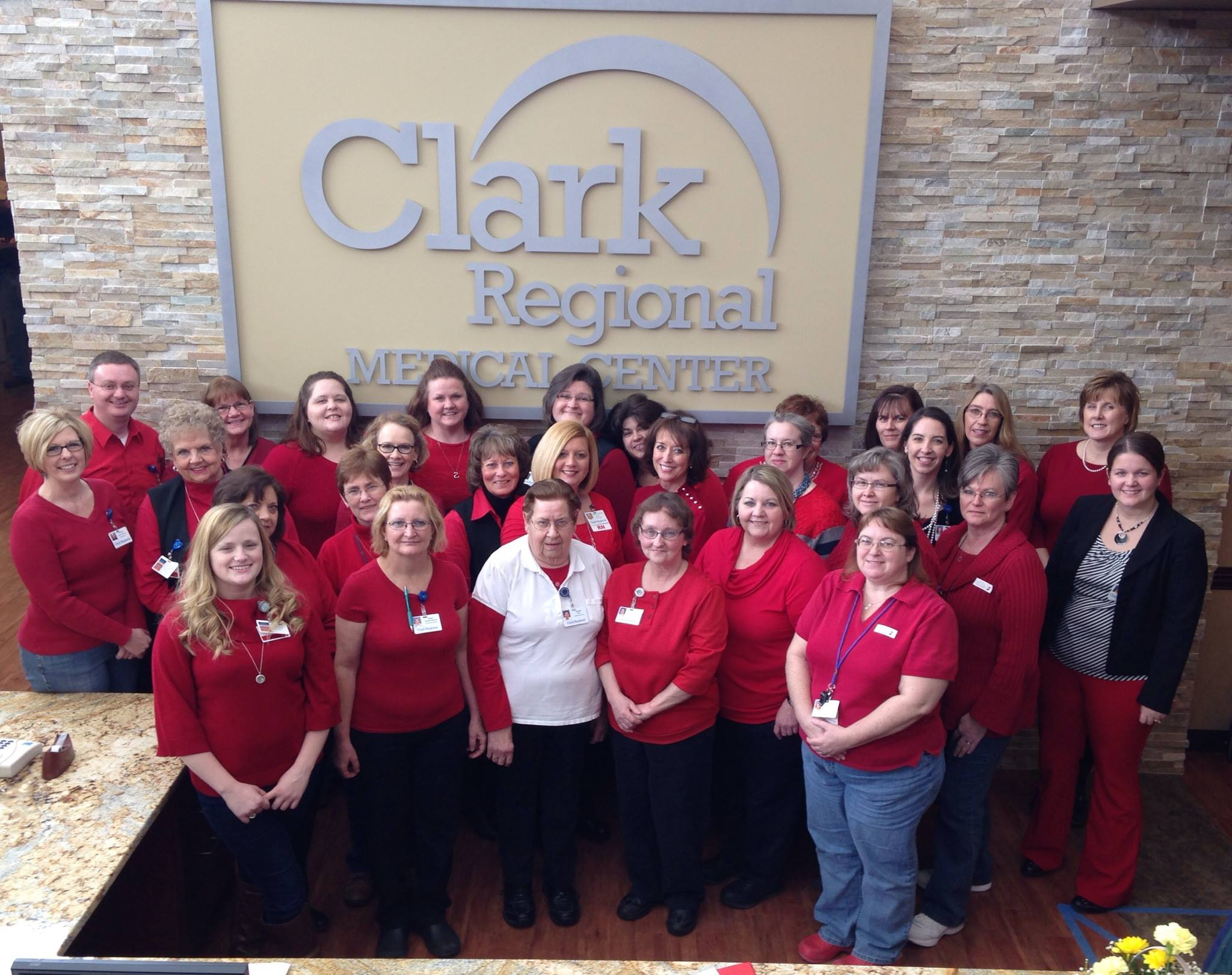 Members of the Clark Regional Medical Center cardiovascular team gathered for a photo in front of their signage.