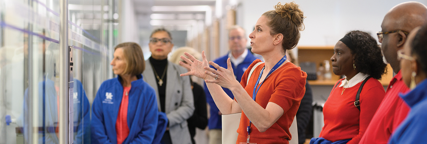 Dr. Krystle Kuhs leads tour of Markey researcher lab