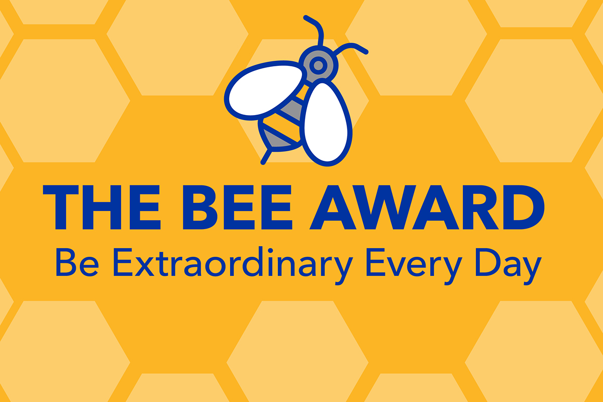 The BEE Award graphic featuring a bee logo over top of a golden honeycomb background with the words "Be Extraordinary Every Day" listed underneath