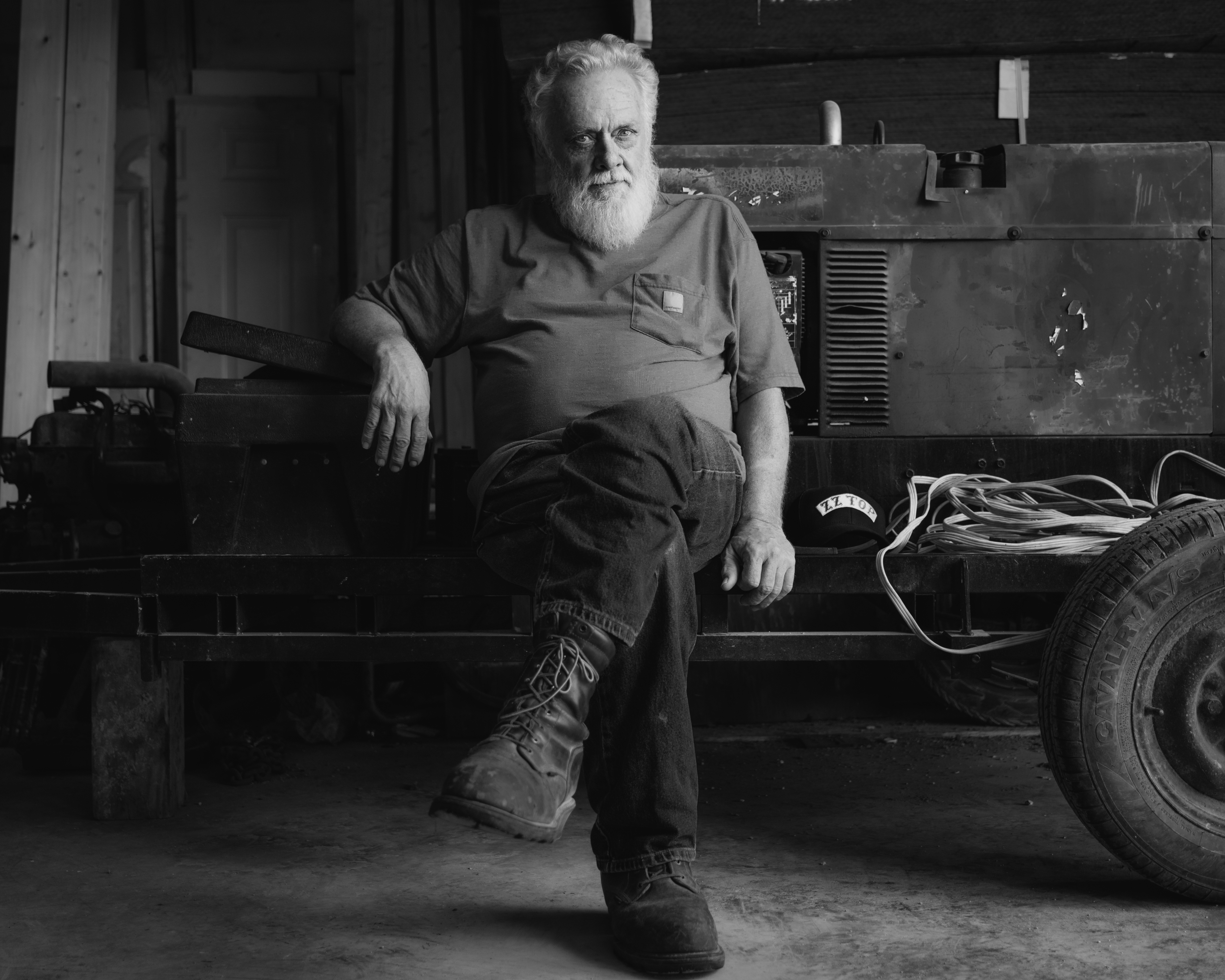 Shorty Carson sitting in his garage