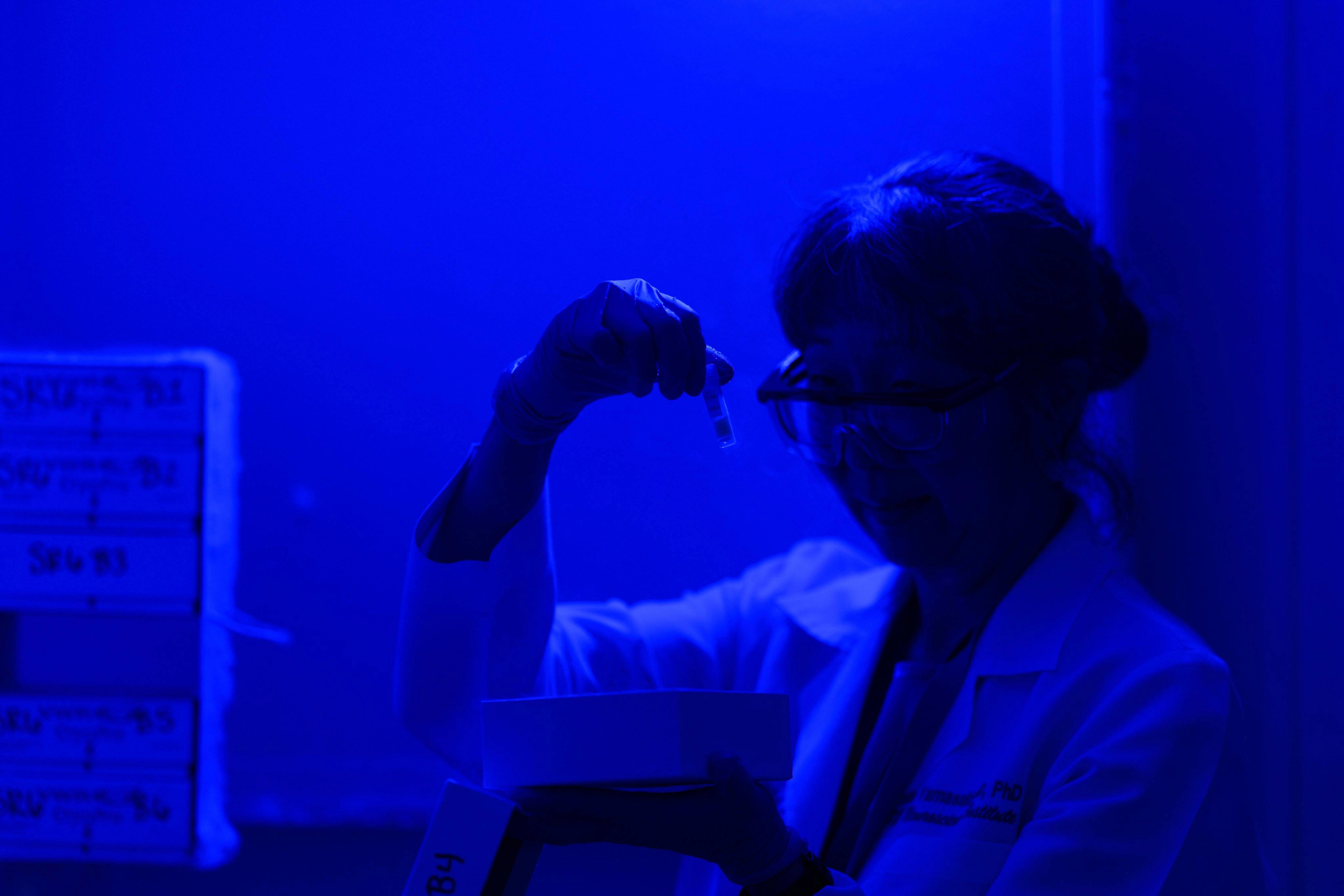 UK HealthCare Neurologist - Dr. Tritia Yamasaki - examines test tube