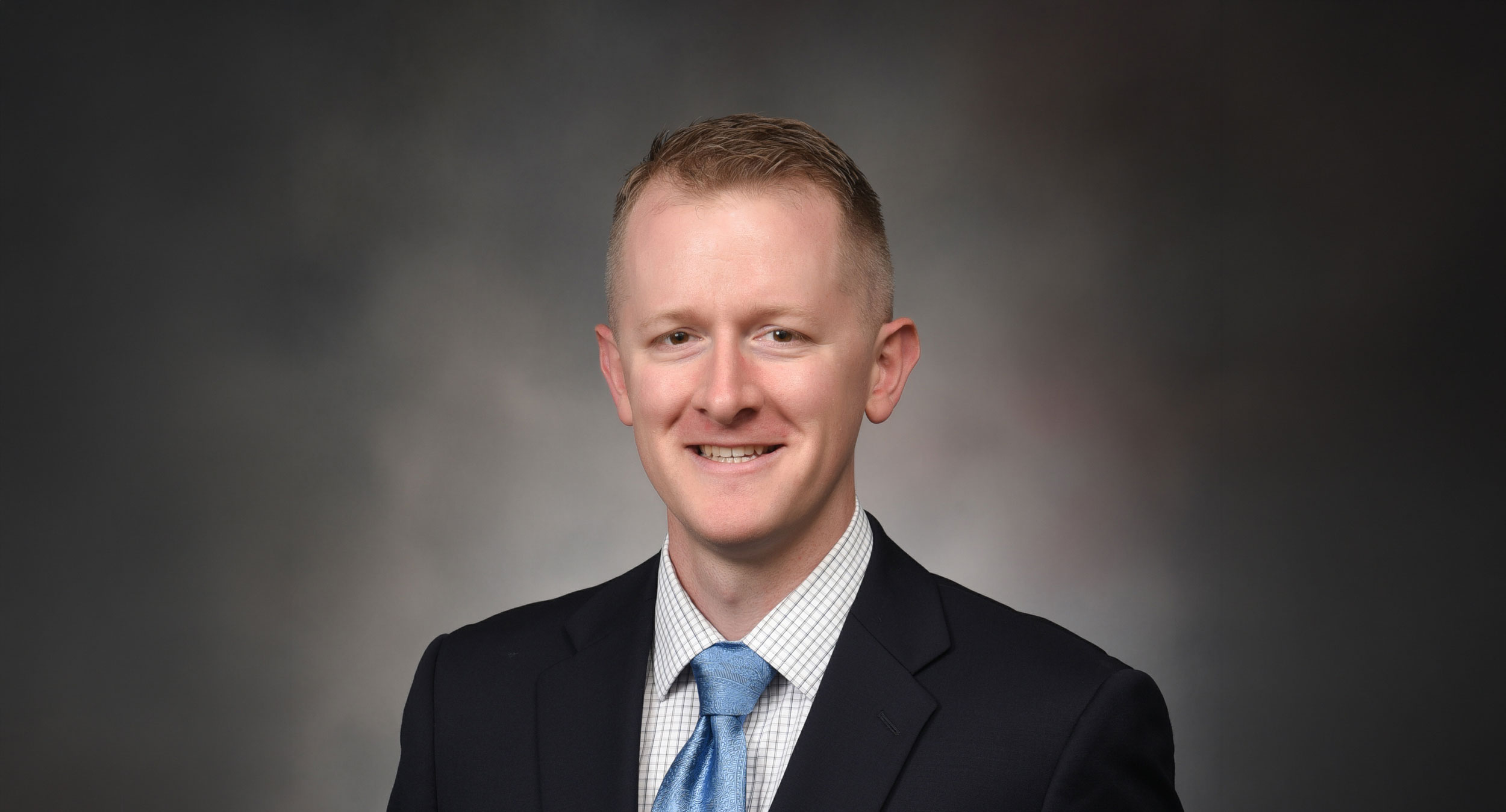 Dr. Lucas Shelton in a suit