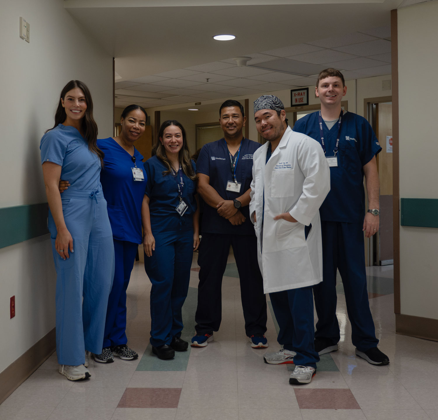 L-R: Holly Schaefer, a rep from Pulmonx; Jasmine Meads, a nurse navigator; Dr. Brenda Garcia; Dr. Ashish Maskey; Dr. Scott Yee; and Matthew McCoy, APRN; they're standing in a hallway for a portrait