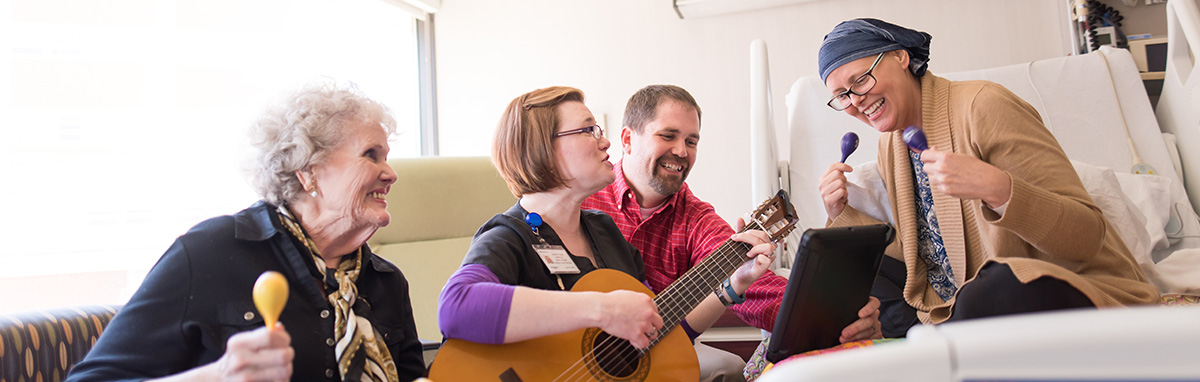 Patient enjoys music therapy session.