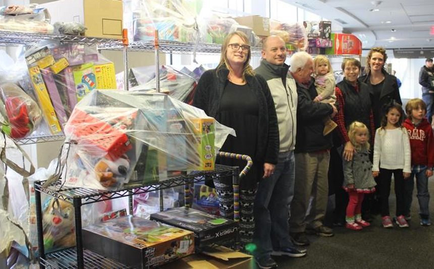 Jonathan Edward Ard's family with toys collected for Kentucky Children's Hospital patients.