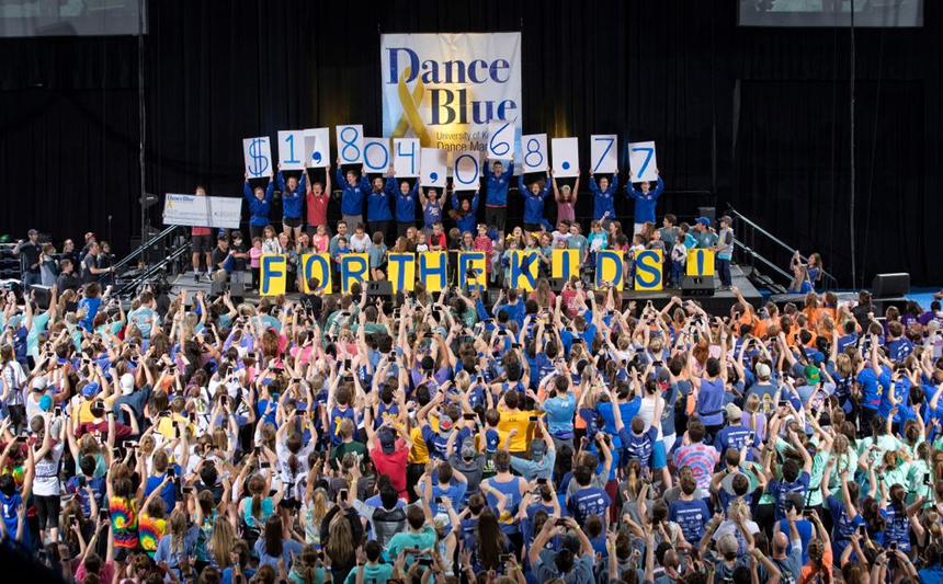 Students held up a sign to announce that DanceBlue 2018 had raised $1.8 million