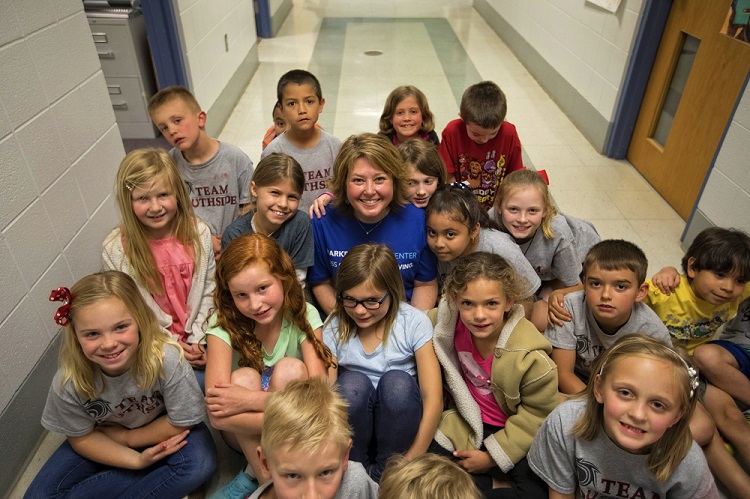 After being treated at the UK Markey Cancer Center, Erika Carter returned to the classroom, where her students were excited to see her.