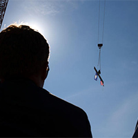 The raising of the signed beam at the Cancer and Advanced Ambulatory Building on July 16