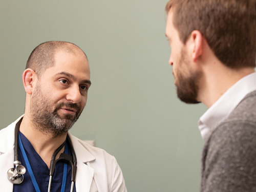 Dr. Andrew Leventhal talks with a patient.