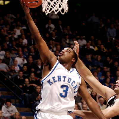 former uk basketball player, brandon stockton, lays up a basketball during his playing days at UK