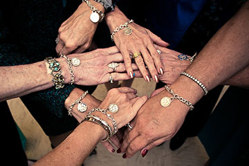 Circle of Blue members and their charm bracelets at a 2012 event.