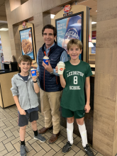 Dr. John Draus eats a Blizzard with his kids.