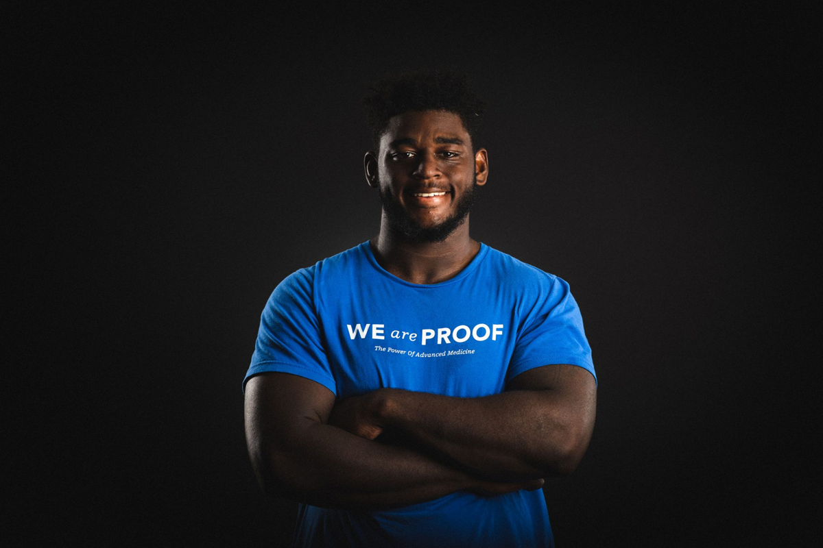 Josh Paschal, wearing a "We Are Proof" t-shirt.