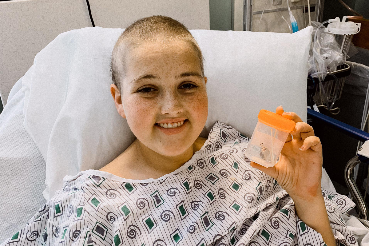 Kylee lost her hair three times during treatment—but never lost her smile.