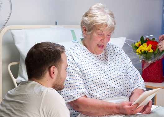 Lady receiving card in the hospital