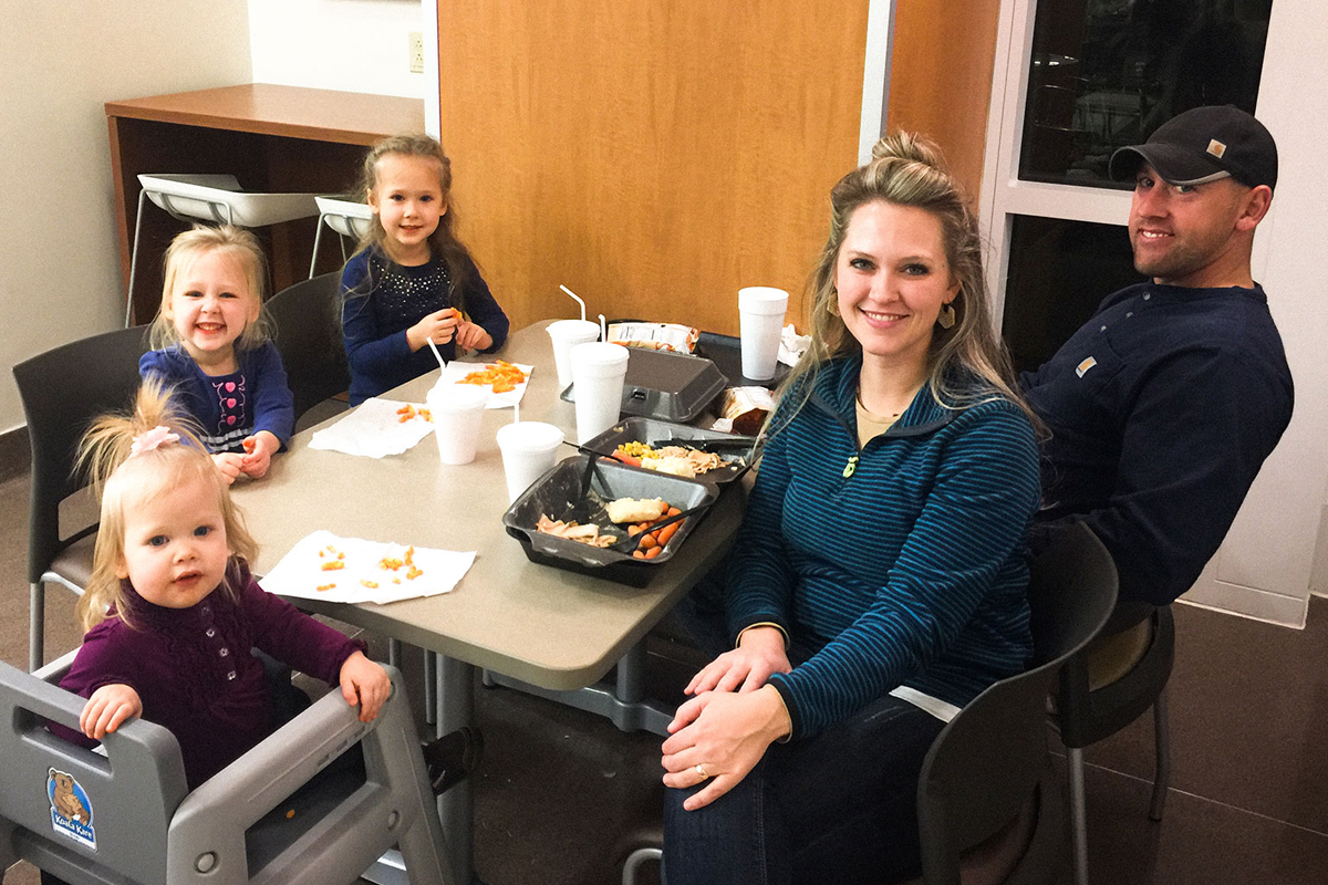 The Watts family gathers for a Thanksgiving meal at the hospital cafeteria.
