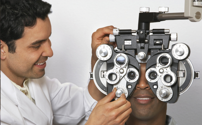 An optometrist examines a man's eyesight.