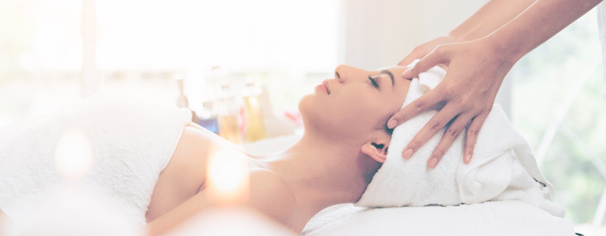 A woman relaxes during her massage.