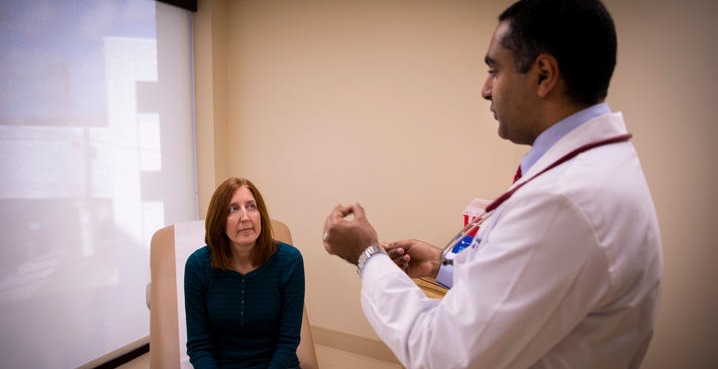 Dr. Moamen Gabr explains the procedure to patient Jackie Denault