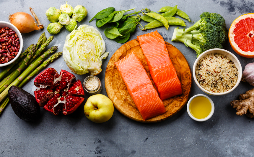 Raw salmon with raw fruits, vegetables and whole grains