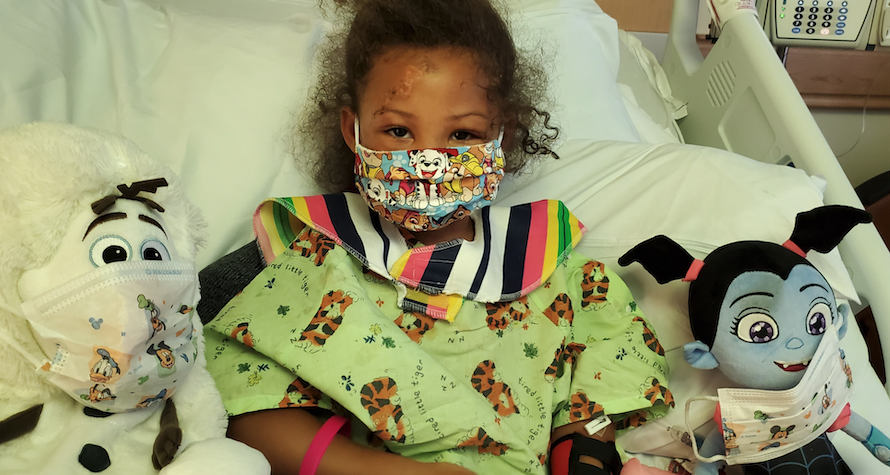 Pediatric patient wearing a face mask.