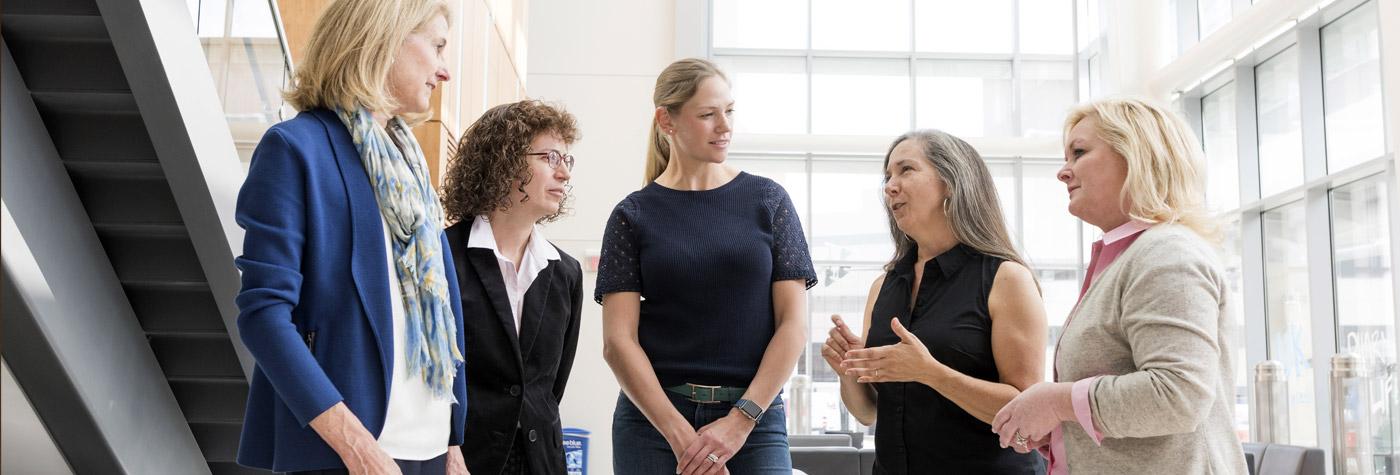 From left to right: Markey Women Strong member Katie Alford; MWS Distinguished Researcher Rina Plattner, PhD; MWS member Josefine Young; MWS Distinguished Researcher Kathleen O’Connor, PhD; and MWS founder Lois Reynolds discuss the work being done by women researchers at the UK Markey Cancer Center.