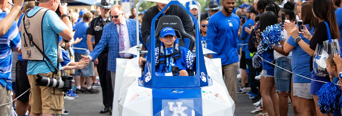 Maximo Shemwell rides in the Kentucky Children's Hospital Lift Them Up vehicle.