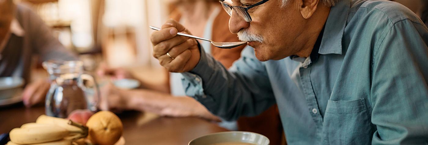Man eats soup