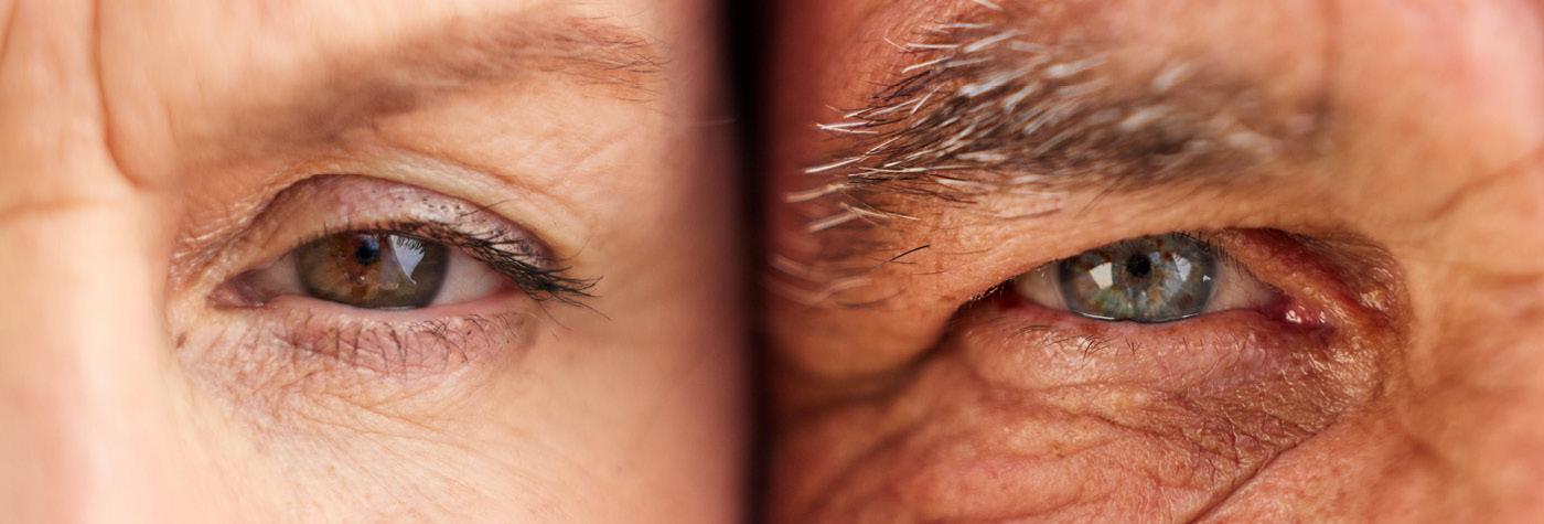 A closeup of two people's eyes side by side