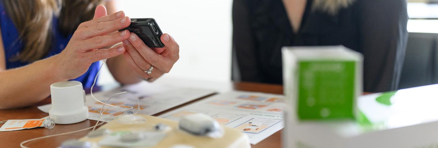 Close up photo of diabetes management tools on a table during a diabetes education session.