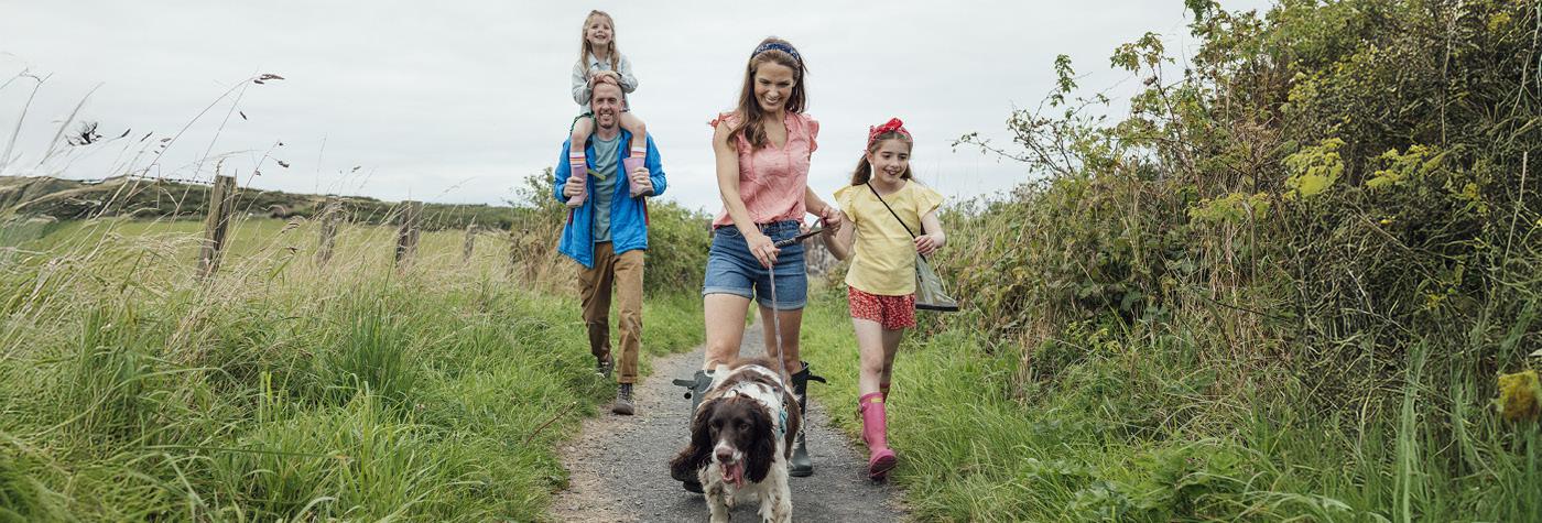 A family walks together outdoors