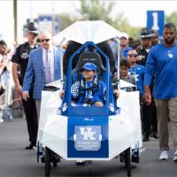 Marco leads the Cat Walk for the UK Football 2019 season opener in a parade of people.