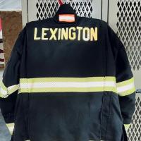 Nick Corman's Lexington Fire Department uniform, hanging from a locker