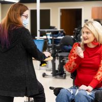 Kayla Lacy looks toward a therapist at the UK HealthCare Outpatient Therapy Clinic.