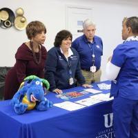 UK HealthCare staff and volunteers speak with one another during the event.
