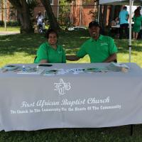 Two representatives from First African Baptist Church table at the event.