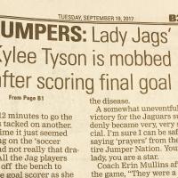 Newspaper headline reads: 'Lady Jags' Kylee Tyson is mobbed after scoring final goal.