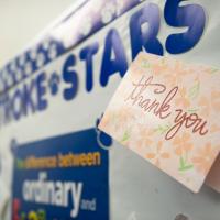 A thank you card taped up to a \