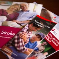 An assortment of pamphlets and booklets about the symptoms of stroke and stroke recovery.
