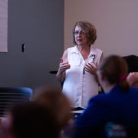 Margie educates a room full of nurses on the symptoms of stroke.