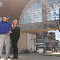 A candid photo of Andy and Julie walking arm in arm through the University of Kentucky campus.