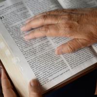 A close-up photo of Becky’s hand on her Bible.