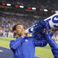 Travis shouts into the bullhorn at a UK Football game.