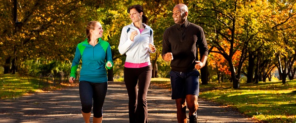 Three people jogging outdoors