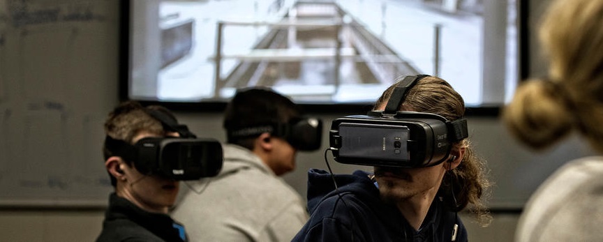Students look at virtual reality.