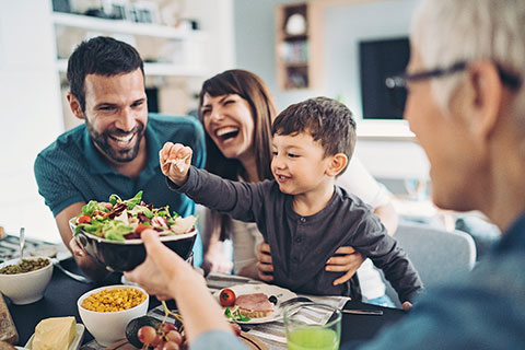 Multigenerational family eating a healthy meal together