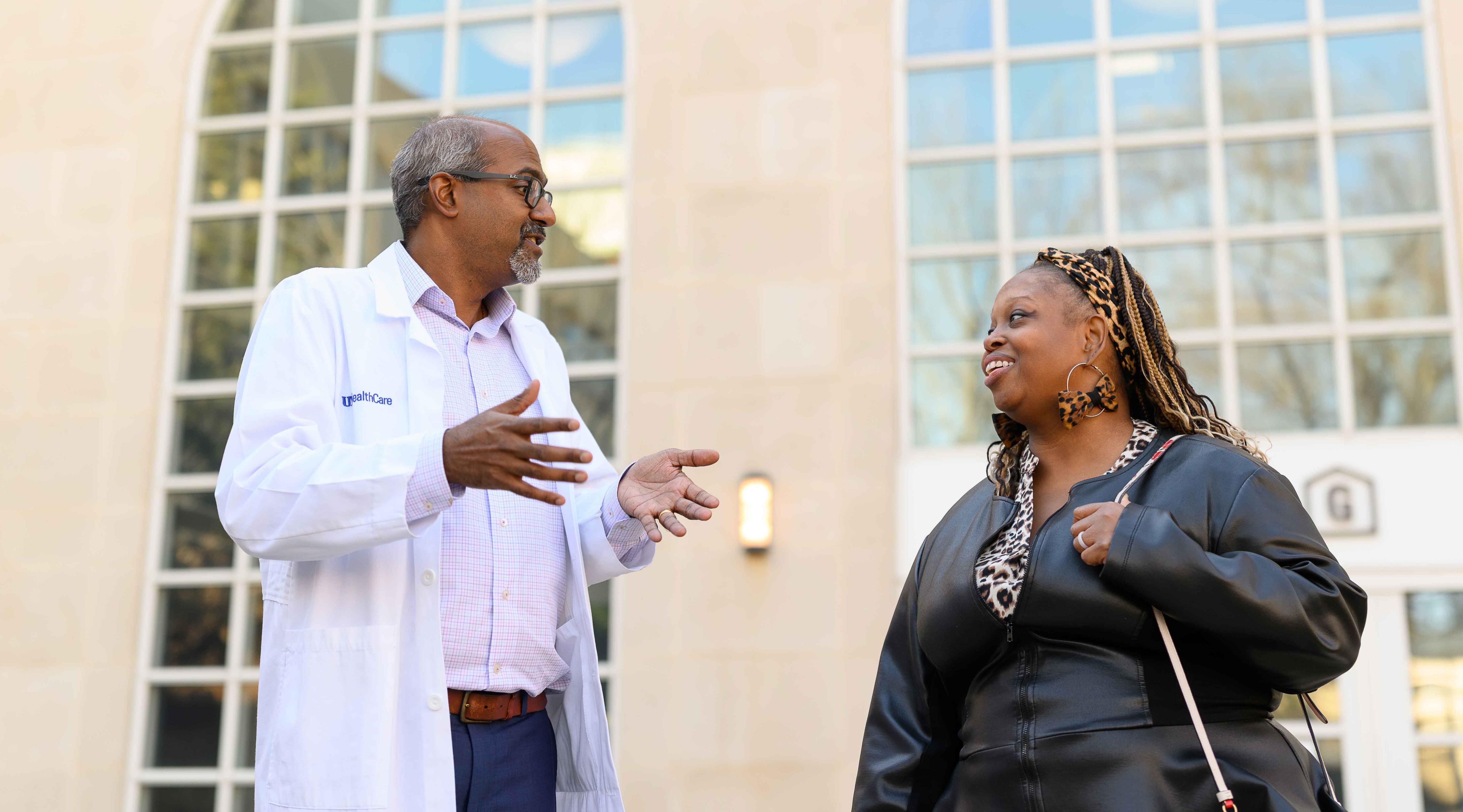 Dr. Navin Rajagopalan talks with a patient outside Gill Heart & Vascular Institute