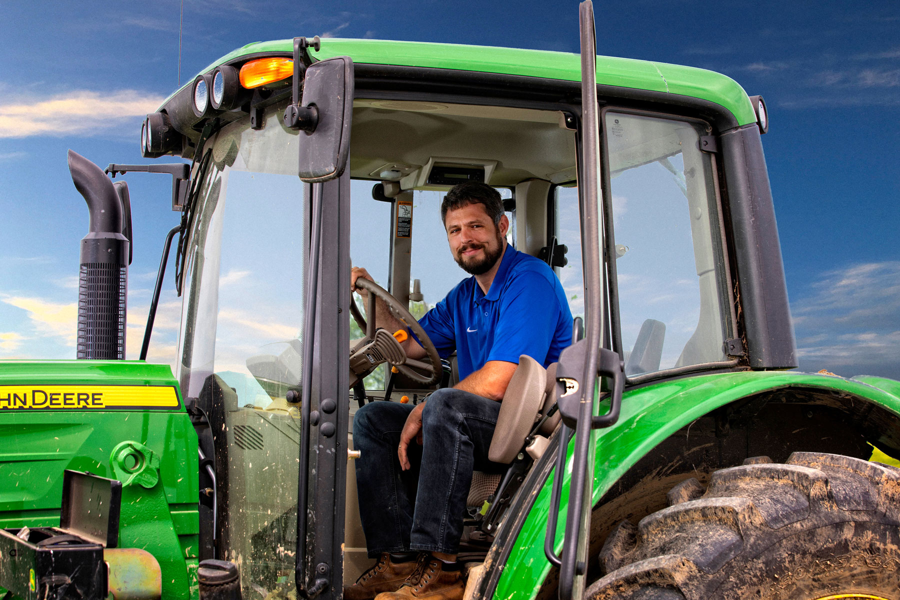 Jacob drives his John Deere tractor.