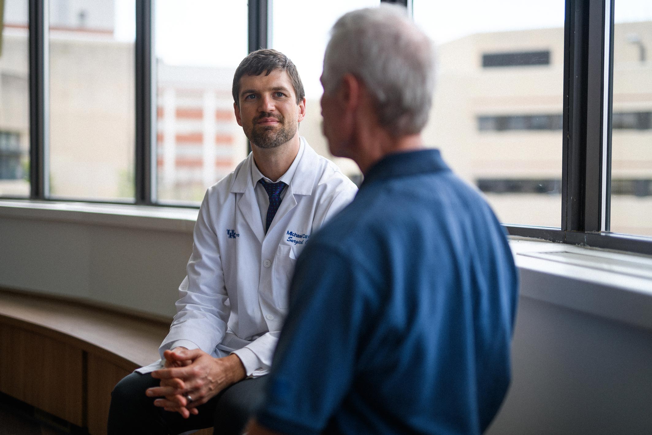 UK HealthCare Markey Cancer Center surgical oncologist Dr. Michael Cavnar discussing treatment options with Joe Marksteiner