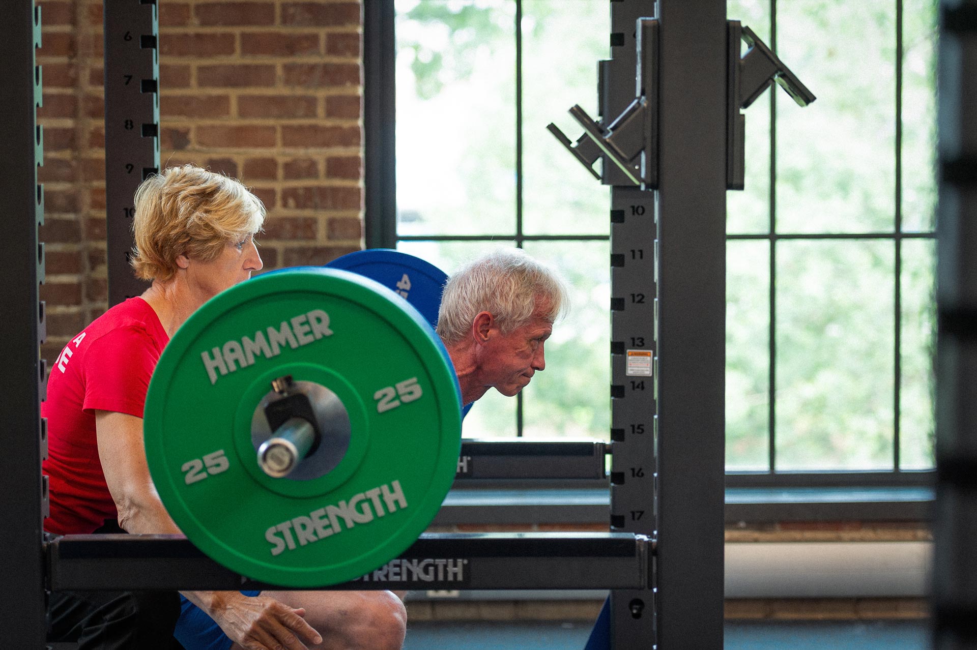 Joe and Cathy Marksteiner lifting weights together